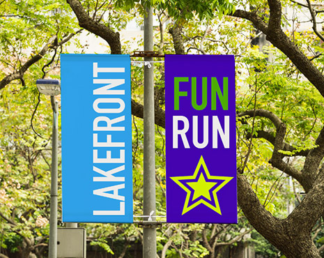 Image of a outdoor banner hung in a park