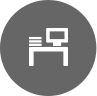 Icon of a computer and desk used to represent Managed Print Services